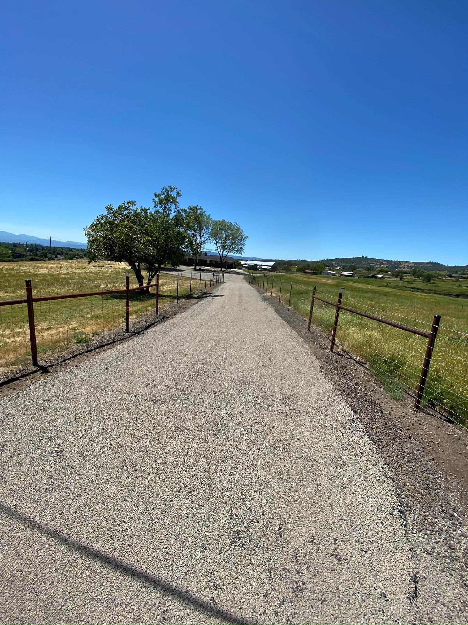 Long rural driveway with a fresh finished surface